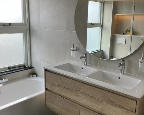 mueble de baño doble con espejo redondo